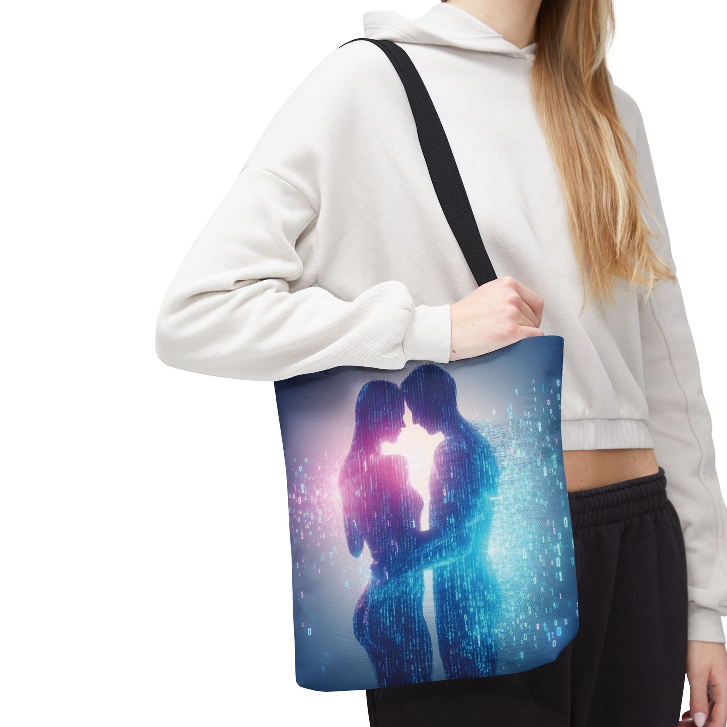 Person holding a tote bag with a design of two people embracing, set against a white background