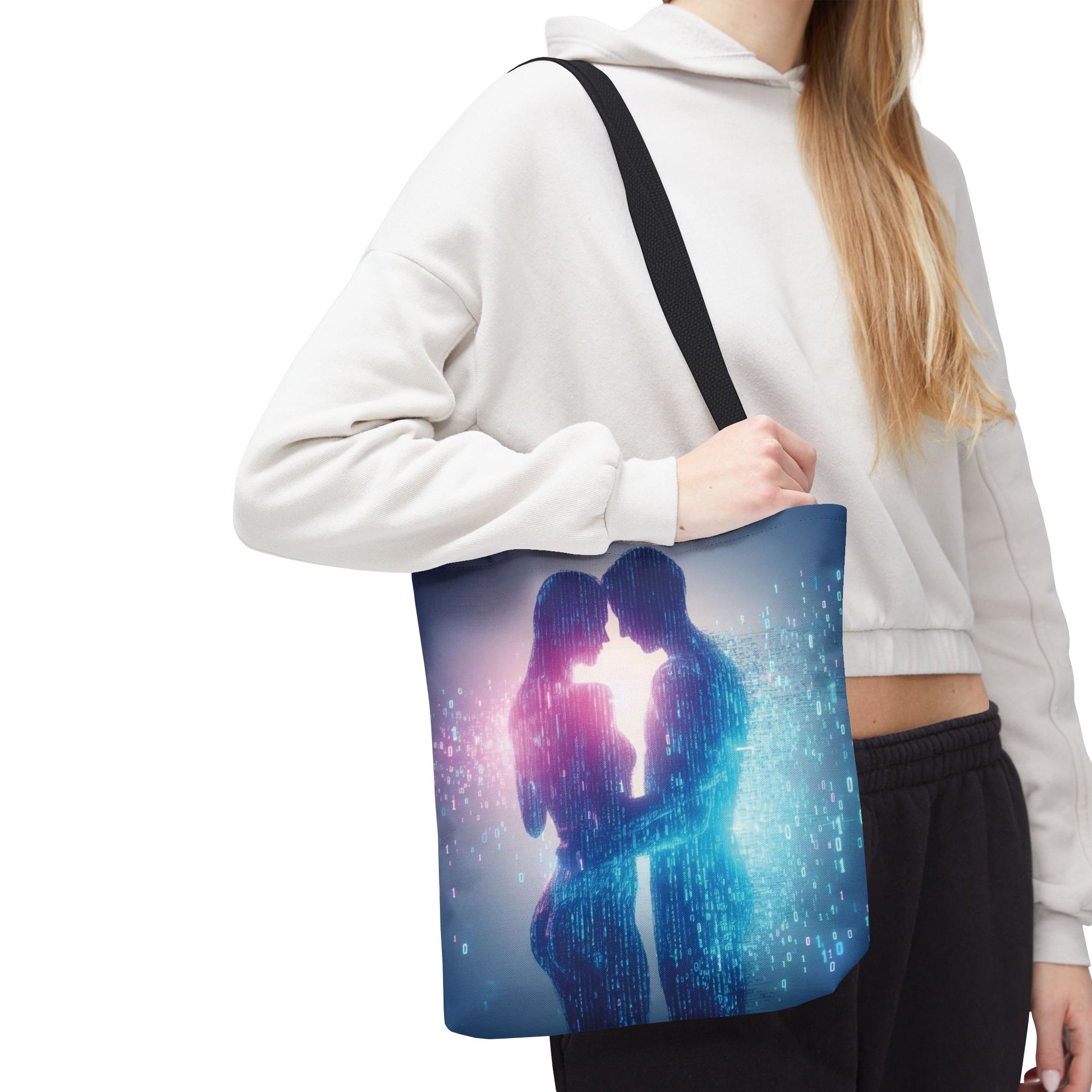 Person holding a tote bag with a design of two people embracing, set against a white background